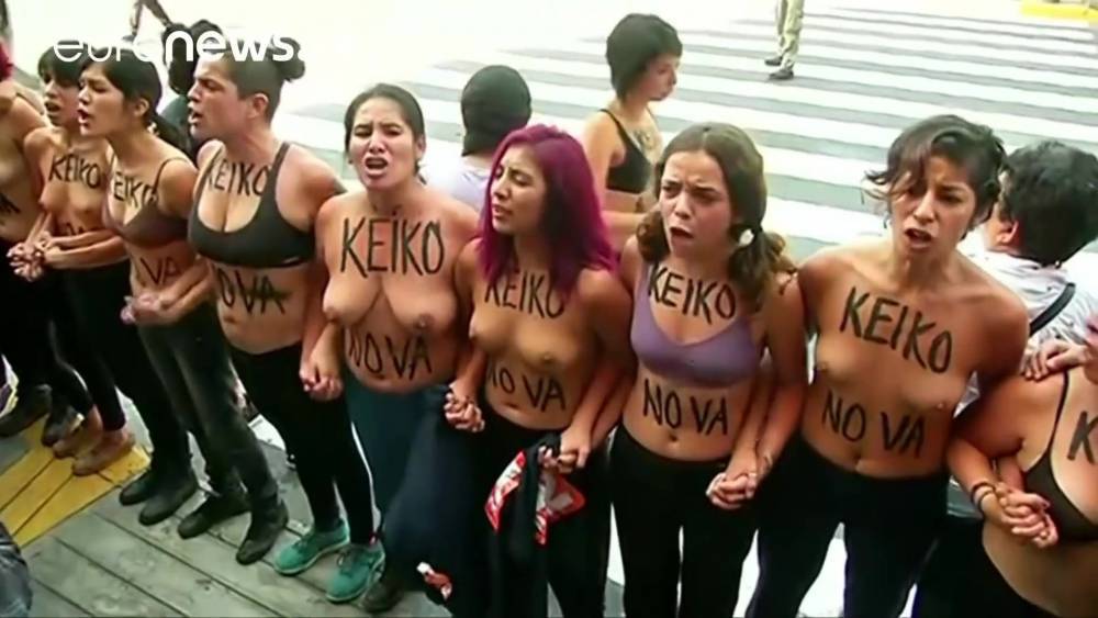 Topless protesters clash with police in Peru - xh.video - Peru