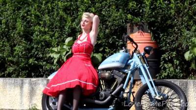 Cute Blonde Enjoys Posing Next To A Bike - hclips.com