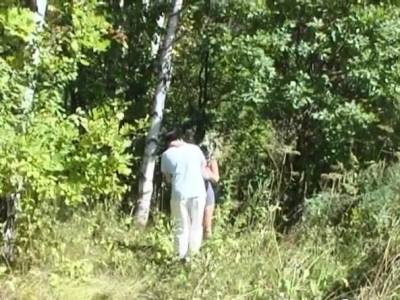 Mature woman having fun in the woods - nvdvid.com