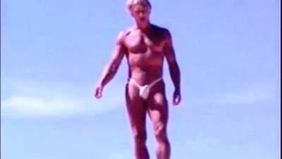 Tanned guy on beach in tiny string thong (temporarily!) - nvdvid.com