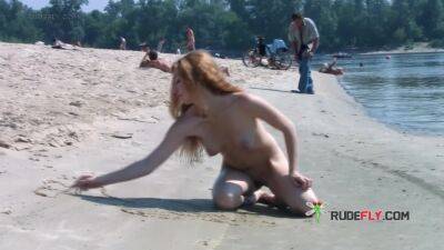 Playful blond nudist teen caught on camera naked at the beach - hclips.com