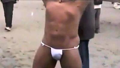 Asian bodybuilder barely covered at the beach - drtuber.com