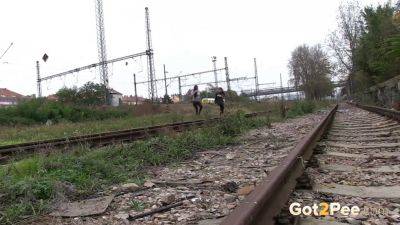 Brunette girls get desperate for a public pee session in the railway - sexu.com - Czech Republic