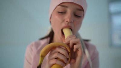 Young nurse and her banana - hclips.com