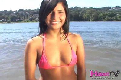 Gorgoeus petite teen teases us at the beach - txxx.com