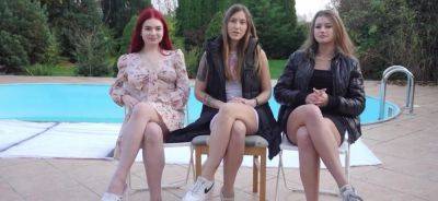 Three girls are playing trip wrestling outdoors - inxxx.com